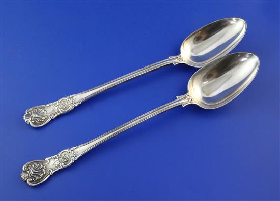 A matched pair of Victorian silver double struck scroll rosette pattern basting spoons, 12.5 oz.